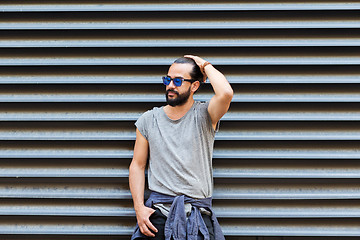 Image showing happy smiling man with beard on city street