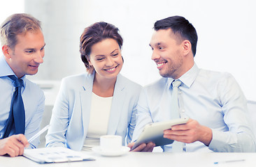 Image showing business team having fun with tablet pc in office