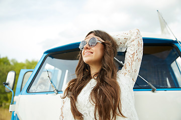 Image showing smiling young hippie woman in minivan car