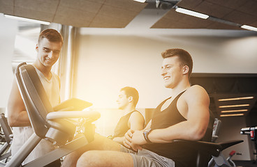 Image showing men exercising on gym machine