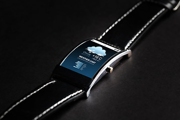 Image showing close up of smart watch with weather forecast