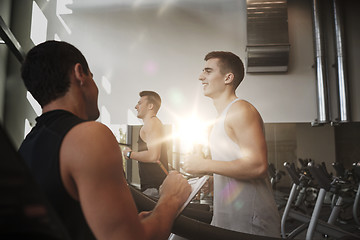 Image showing men exercising on treadmill in gym