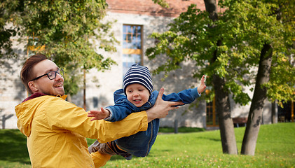 Image showing father with son playing and having fun outdoors