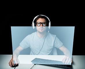 Image showing man in headset playing computer video game