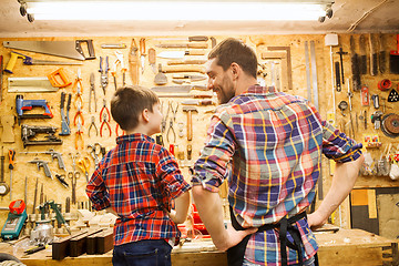 Image showing happy father and little son workshop