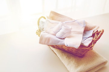 Image showing close up of baby clothes for newborn boy in basket