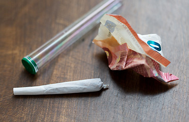 Image showing close up of marijuana joint and money