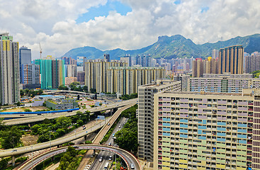 Image showing hong kong public estate with landmark lion rock at day