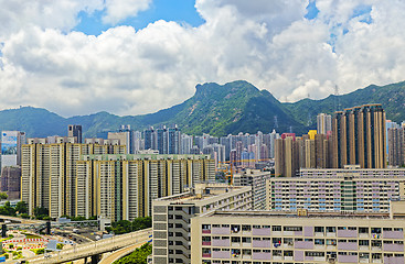 Image showing hong kong public estate with landmark lion rock at day