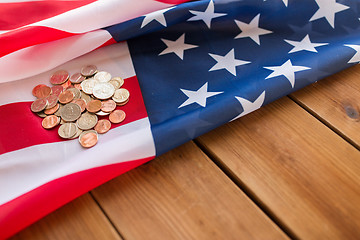 Image showing close up of american flag and money on wood