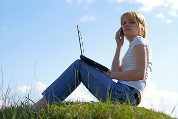 Image showing girl with notebook and phone on green grass