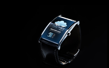 Image showing close up of smart watch with weather forecast