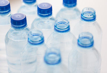 Image showing close up of bottles with drinking water on table