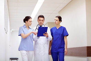 Image showing group of medics at hospital with clipboard