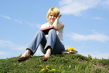 Image showing female student outdoor on green grass