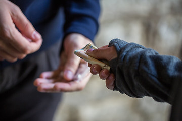 Image showing close up of addict buying dose from drug dealer