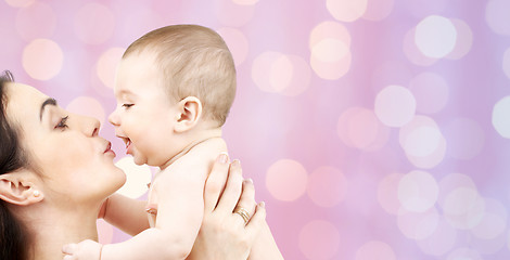 Image showing happy mother kissing adorable baby