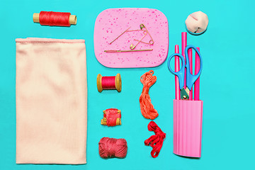 Image showing Vintage pink and red accessories for sewing