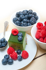 Image showing green tea matcha mousse cake with berries