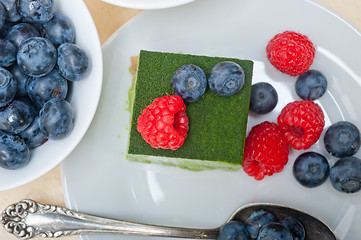 Image showing green tea matcha mousse cake with berries