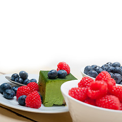 Image showing green tea matcha mousse cake with berries