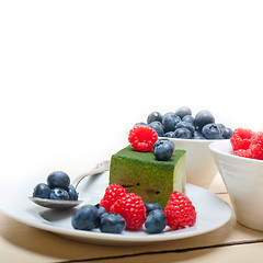 Image showing green tea matcha mousse cake with berries