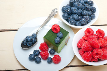 Image showing green tea matcha mousse cake with berries