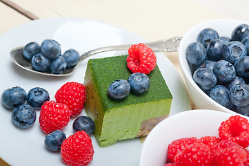 Image showing green tea matcha mousse cake with berries