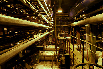 Image showing Equipment, cables and piping as found inside of a modern industr