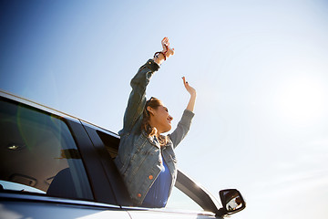 Image showing happy teenage girl or young woman in car