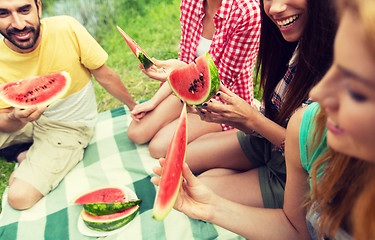 Image showing happy friends eating watermelon at camping