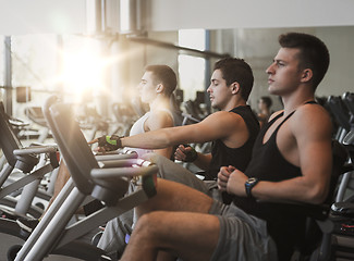 Image showing men working out on exercise bike in gym