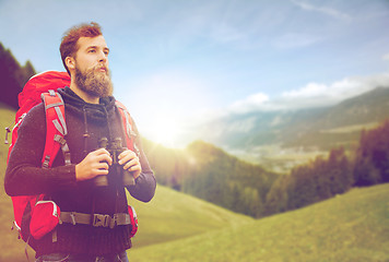 Image showing man with backpack and binocular outdoors