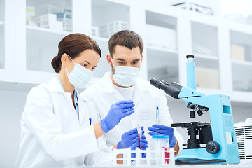 Image showing young scientists making test or research in lab