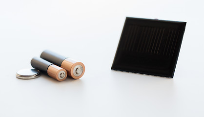 Image showing close up of alkaline batteries and solar cell