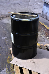 Image showing Black metal barrel of combustive-lubricating chemicals 