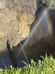 Image showing The water jet in the form of leakage in the damaged metal pipe at the production site