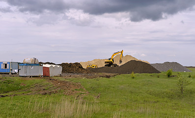 Image showing  Yellow excavator working digging in sand quarry