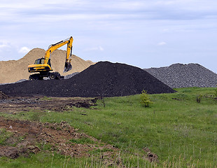 Image showing  Yellow excavator working digging in sand quarry