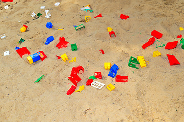 Image showing Children's sandbox with toys scattered
