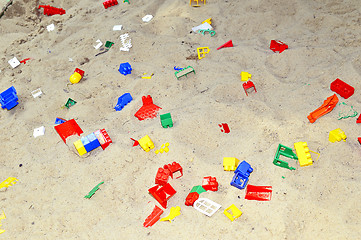 Image showing Children's sandbox with toys scattered