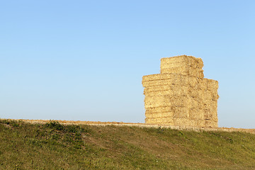 Image showing haystacks in a field of straw  