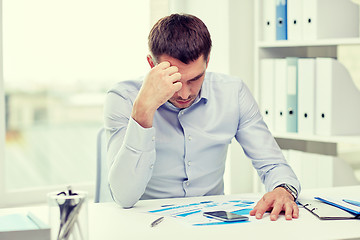 Image showing close up of businessman with smartphone