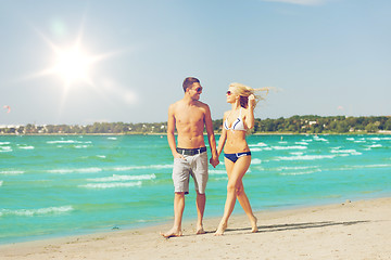Image showing couple walking on the beach