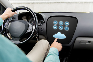 Image showing close up of man driving car with menu on computer