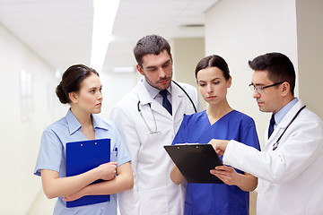 Image showing group of medics at hospital with clipboard