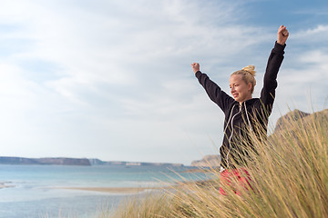 Image showing Free Happy Woman Enjoying Sun on Vacations.