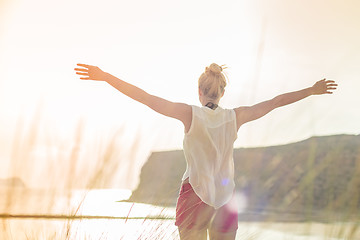 Image showing Free Happy Woman Enjoying Sun on Vacations.