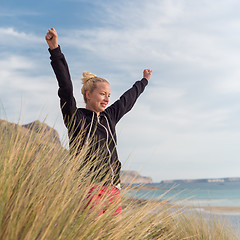 Image showing Free Happy Woman Enjoying Sun on Vacations.