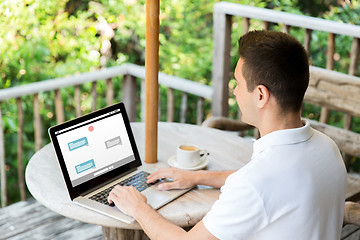 Image showing close up of businessman with laptop on terrace